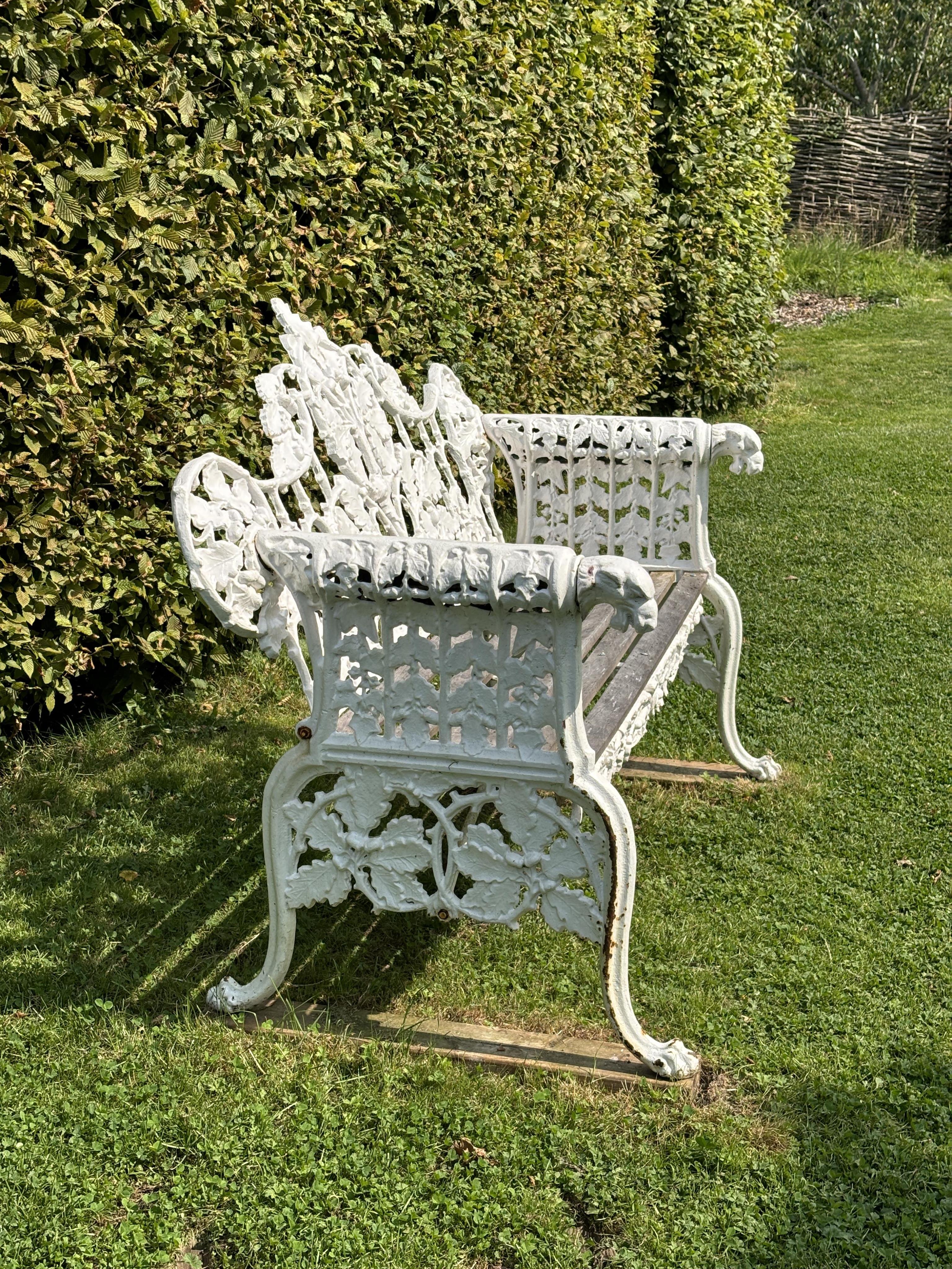 A pair of Coalbrookdale style cast iron garden benches